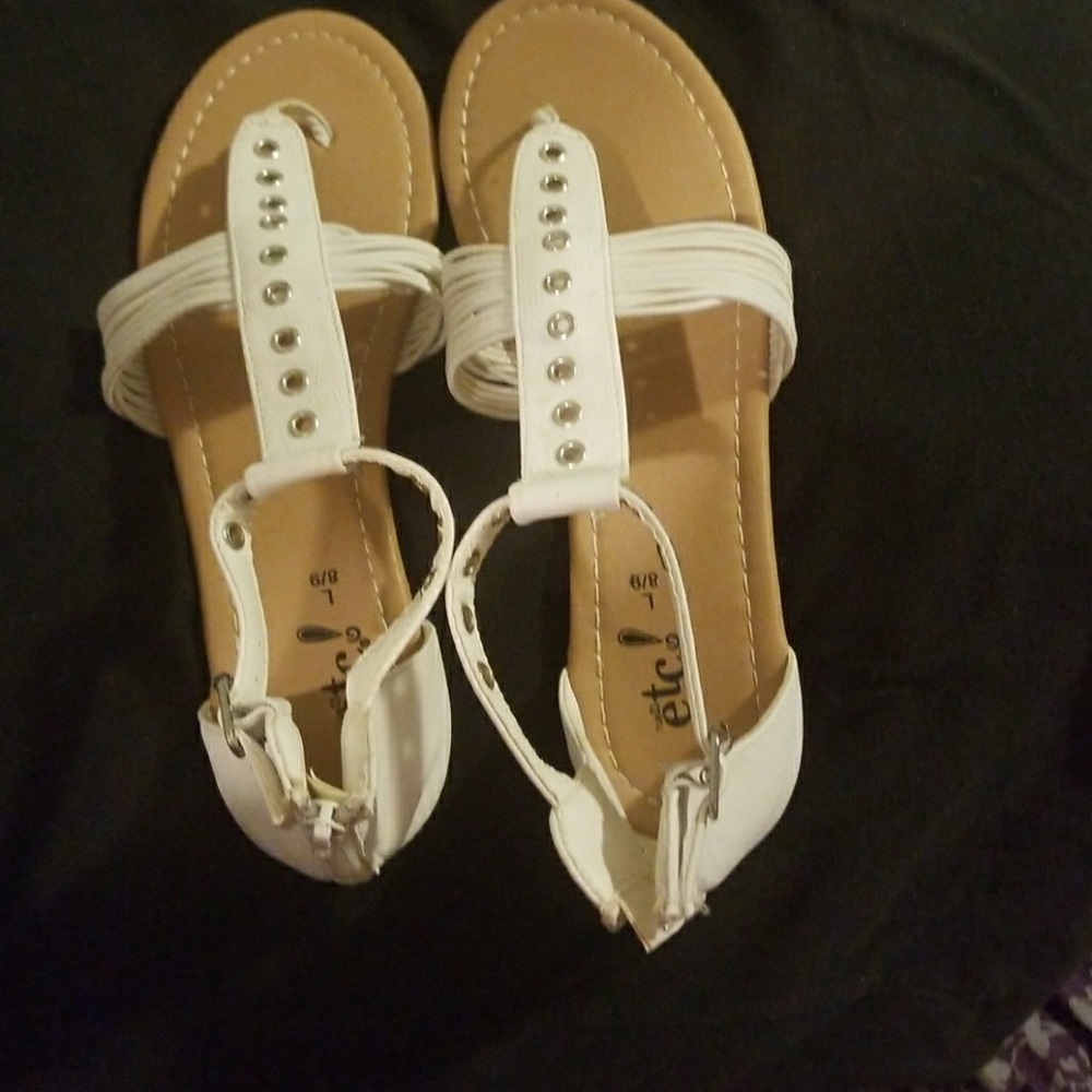 A cute pair of summer sandals that zip up the back